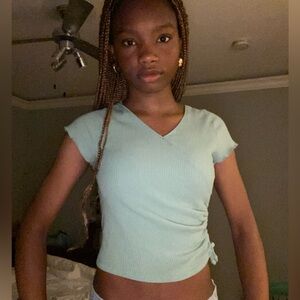 Mint green crossover below belly button crop